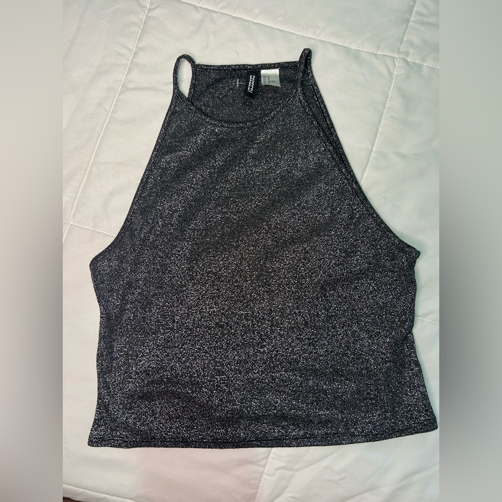 Short, simple, shiny and transparent black shirt.